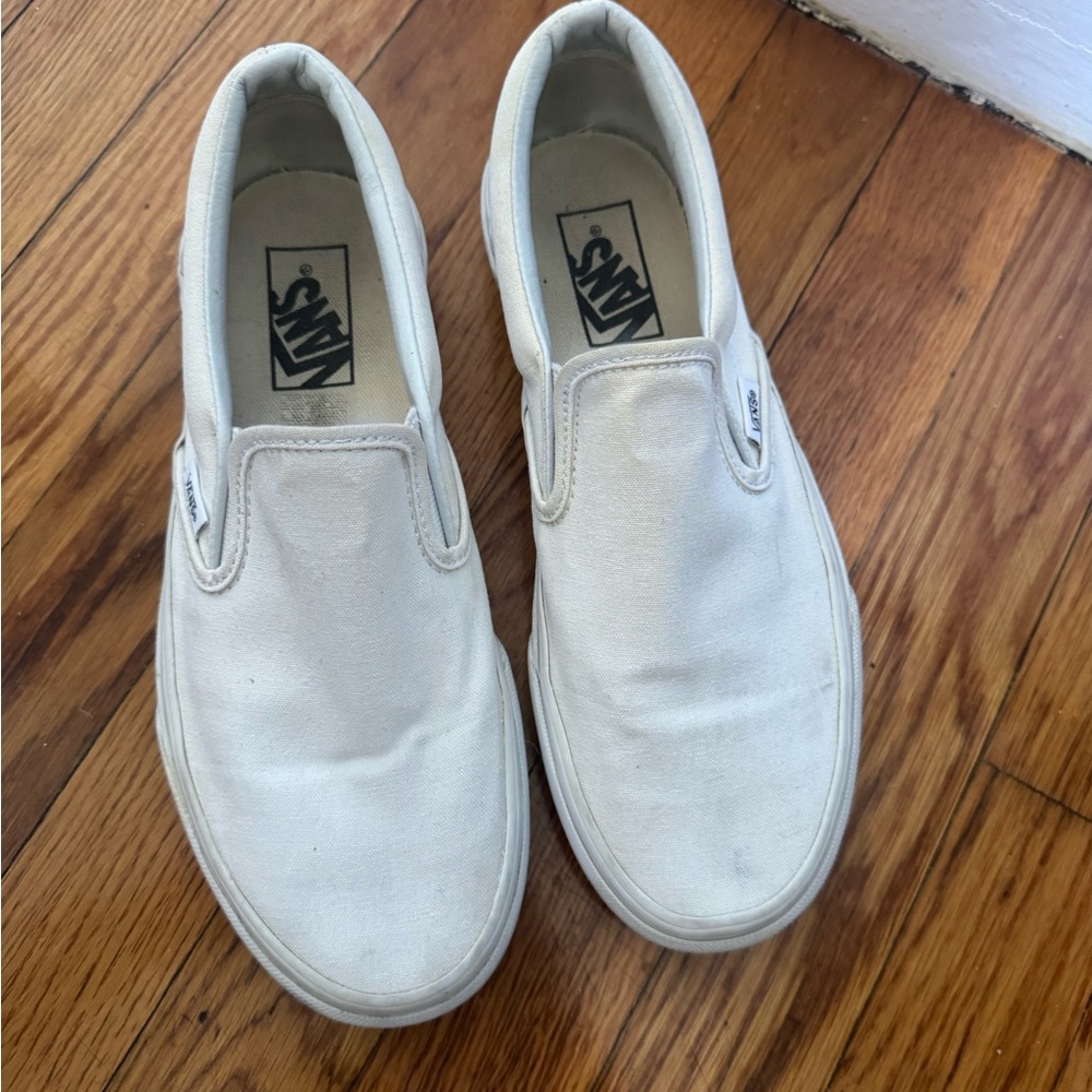 White classic slip on vans.